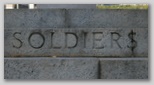 Soldier$? Unfortunate brickwork on a war memorial