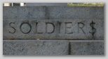 Soldier$? Unfortunate brickwork on a war memorial
